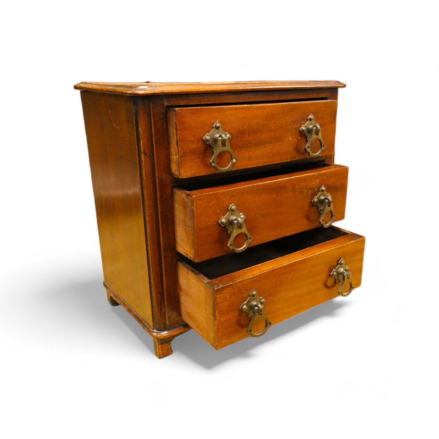 An Edwardian miniature mahogany three drawer chest, 26cm wide x 28cm high. Condition - fair to good